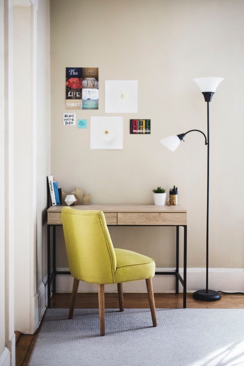 table, chair, desk, lamp, room, carpet, posters, picture stickers, chair, chair, desk, desk, desk, lamp, room, room, room, room, room